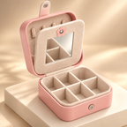 Pink travel jewelry organizer with mirror — styled studio image